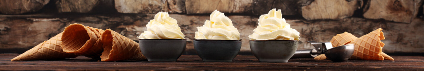 Vanilla soft served ice cream tasty sundae dairy ice cream on rustic background