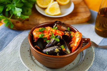 Boiled mussels and fried shrimps, lemon and parsley.