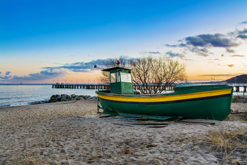 Fototapeta premium fishing boat on the beach in Gdansk, Poland