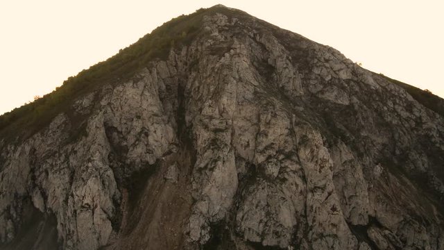 The remain of the reef of the ancient sea, composed of limestone - shikhan Yuraktau. Indian summer in the floodplain of the Belaya River. Aerial view.