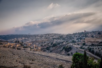 Fototapeta na wymiar Beautiful view of jewish cemetery and Jerusalem Old City from the Mount of Olives. Israel. Evening light