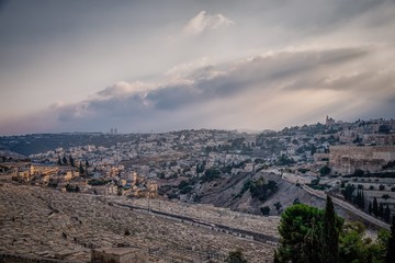 Beautiful view of jewish cemetery and Jerusalem Old City from the Mount of Olives. Israel. Evening light