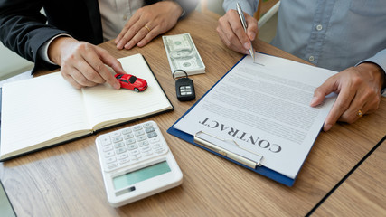 agent broker man holding document showing an transportation contract form to client ownership  customer and salesman with car key.