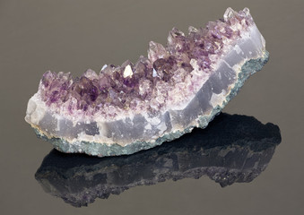 light amethyst in geode on dark background