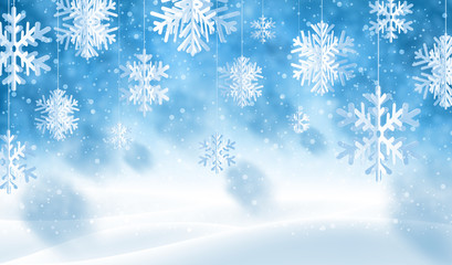 Winter blue background with white paper kirigami snowflakes.