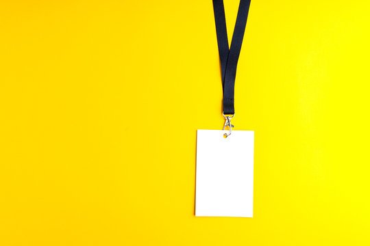 Blank white bagde on yellow background