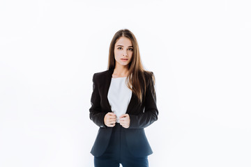 Obraz premium confident businesswoman in suit with hands on jacket isolated on white