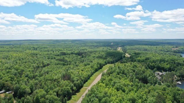 Road Through Michigan's Upper Peninsula in Summer (Drone)