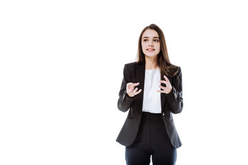 Obraz premium irritated businesswoman in suit gesturing isolated on white