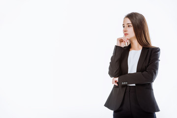 Obraz premium thoughtful businesswoman in suit looking away isolated on white