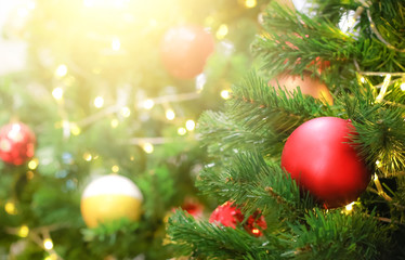 Blurry of Christmas and New Year's balls with beautiful decorations on the Christmas tree, soft light, beautiful background images and illustrations.
