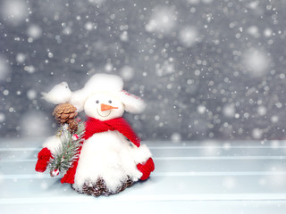 Naklejka na ściany i meble winter background with snowman decor and snow