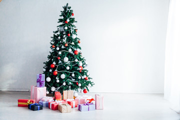Christmas home decor with Christmas tree and gifts for the new year