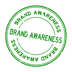 Grunge green brand awareness word round rubber seal stamp on white background