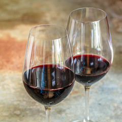 red wine drinking glass (delicious alcoholic drink, holiday) menu concept. food background. top view. copy space