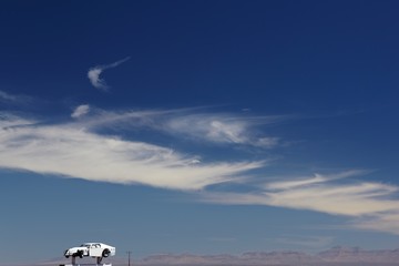 Fototapeta na wymiar Car on desert horizon USA