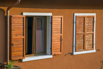 Wooden shutters on the windows of an old house