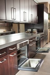 Commercial Kitchen With Open Oven And Cabinets