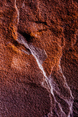 A natural background made of multi-colored wild stone close-up. View from above