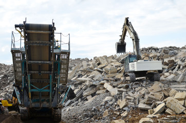 Salvaging and recycling building and construction materials. Industrial waste treatment plant....