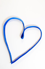 Blue heart made of ribbon on a white background. Valentine's Day. Love. Copy space