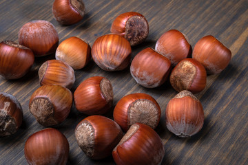 Hazelnuts on a wooden table. Food, snack background