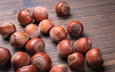 Hazelnuts on a wooden table. Food, snack background