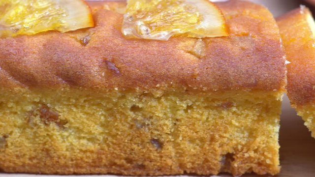 Orange cake and slices close-up panning shot