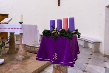 Stand with decorative candles in interior of the Our Lady of the Ark of the Covenant Church in the Chechen village Abu Ghosh near Jerusalem in Israel