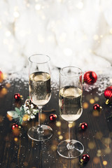 Christmas and New Year celebration with glasses of champagne