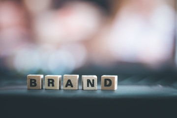 Business brand and identity concept: Close up picture of wooden cubes with the word “Brand”
