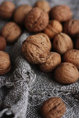 Walnuts on a grey linen background macro 