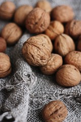 Walnuts on a grey linen background macro 