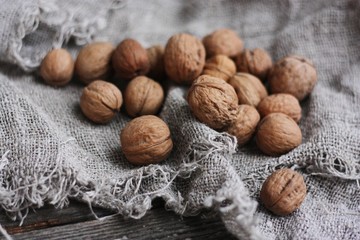 Walnuts on a grey linen background macro 