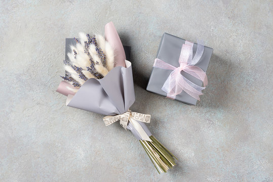 Bouquet of lavender and lagurus with gray-purple packaging with a gift box in a single color.