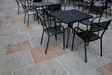 Tables and chairs at outdoor cafe