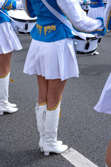 group of girls drummers. parade on a city street. body parts closeup