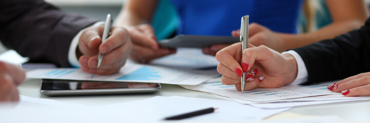 Silver pen lie on important paper at table