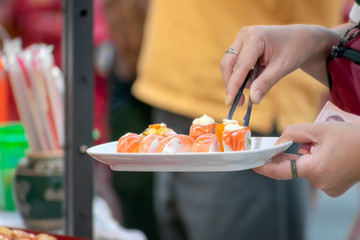 Obraz na płótnie Canvas Low Cost Raw Salmon Sushi from Food Stall.