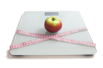 Apple on the scales. The concept of losing weight.