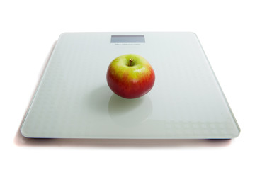 Apple on the scales. The concept of losing weight.