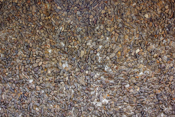 pea gravel texture layered on ground with multi colored stones