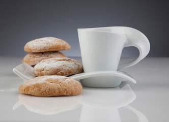Delicious breakfast with cookies and a cup of coffee or tea (white crockery)