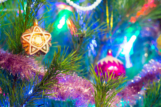 Christmas tree decorated with toys and lights.