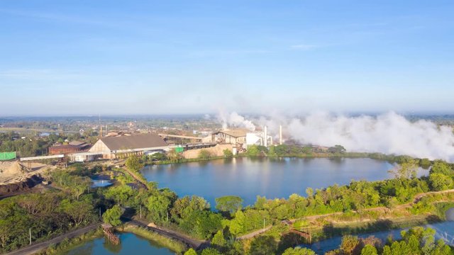 Hyperlapse Aerial view sugar factories are producing sugar. Cooling systems cause a lot of haze.