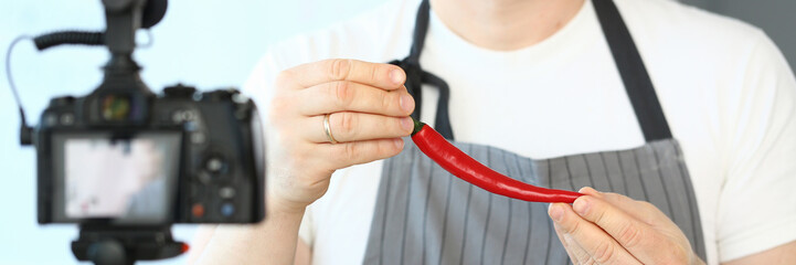 Blogger Man Recording Red Chili Pepper Recipe