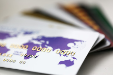 Many bank cards scattered on table