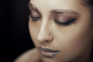 Naklejka premium beautiful young sexy girl with bright makeup with clean skin and delicate lips in gray