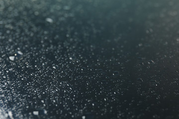 Many water drops on dark background, close up