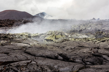 Steaming, sulfuric, active fumaroles near volcano Tolbachik, Kamchatka Peninsula, Russia